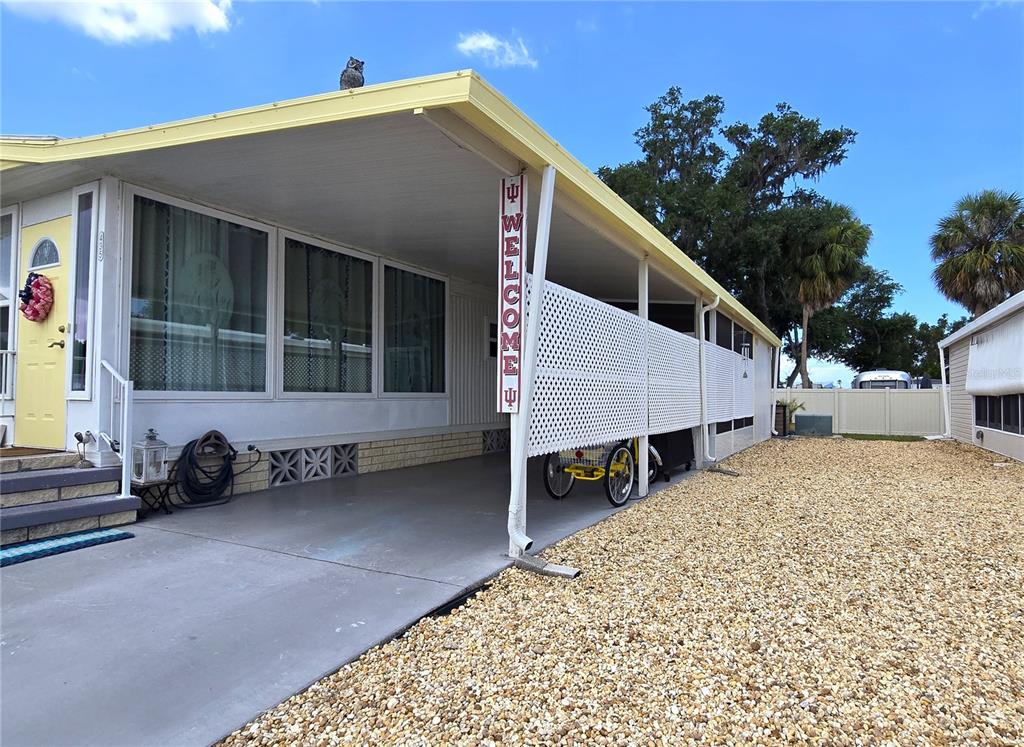 5619 Bayshore Road, Unit 435 Palmetto, FL 34221 - Photo 36 of 56 a front view of a house with a yard