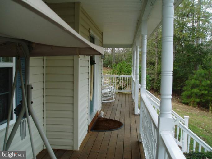 12317 Rashad Circle Lusby, MD 20657 - Photo 9 of 30 Front Porch - Swing and Chairs convey