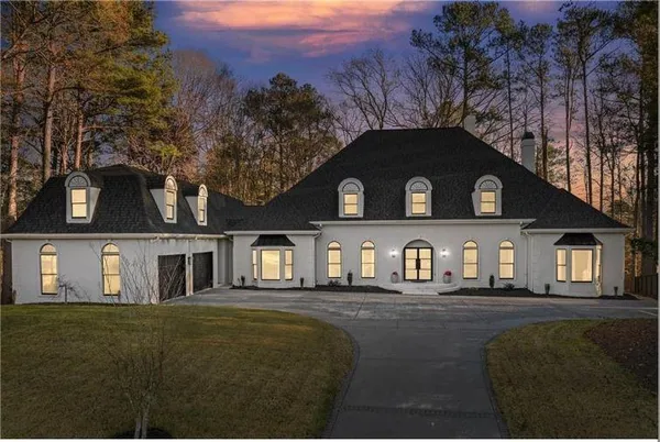 a front view of a house with a yard