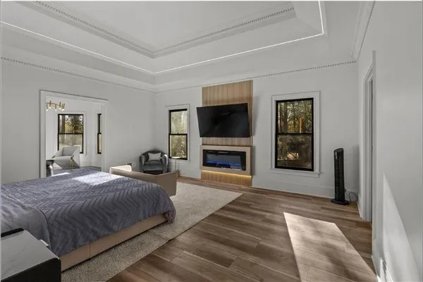 a bathroom with a tub and toilet