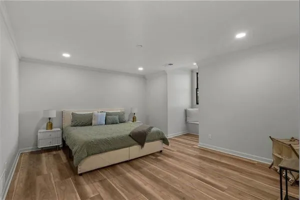a spacious bedroom with a bed and a walk in closet