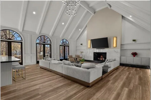 a living room with fireplace furniture and a flat screen tv
