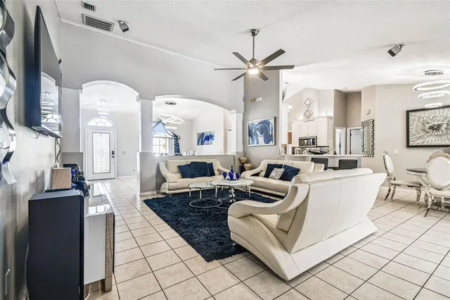 a kitchen with a sink and white cabinets