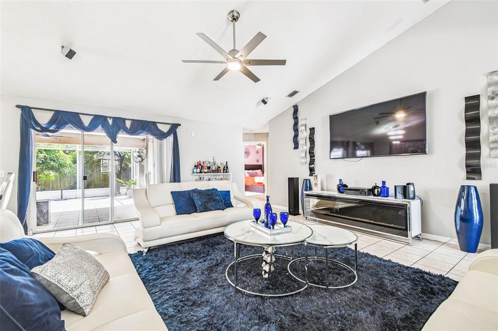 9804 Ocasta Street Riverview, FL 33569 - Photo 21 of 80 a living room with furniture a rug and a flat screen tv