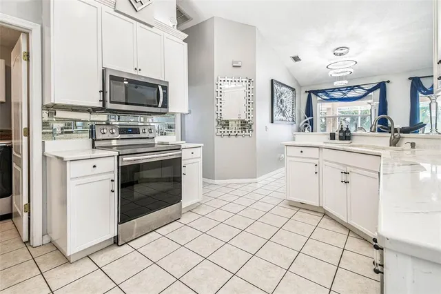 a bedroom with a bed and a large mirror