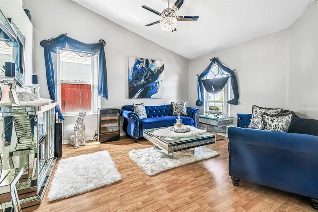 a living room with furniture and a large window