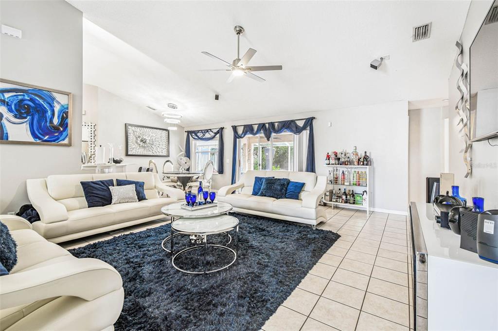 9804 Ocasta Street Riverview, FL 33569 - Photo 4 of 80 a living room with furniture and a large window