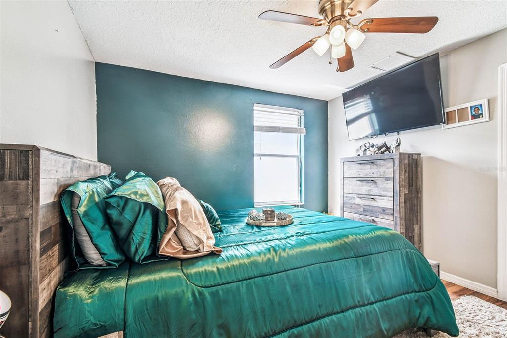 9804 Ocasta Street Riverview, FL 33569 - Photo 42 of 80 a bedroom with a bed and a television
