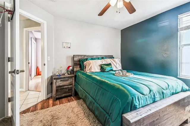 a front view of house with yard and car parked