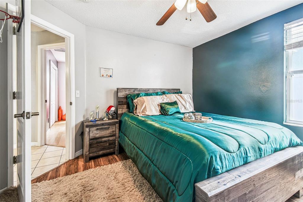 9804 Ocasta Street Riverview, FL 33569 - Photo 43 of 80 a bedroom with a bed and a large mirror