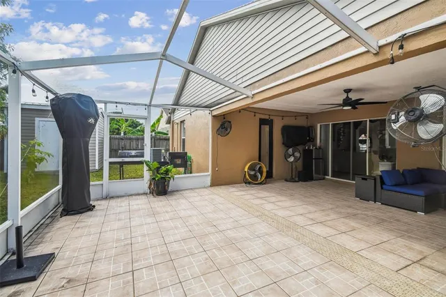 an aerial view of multiple houses with a yard