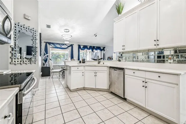 a front view of a house with a garden and yard