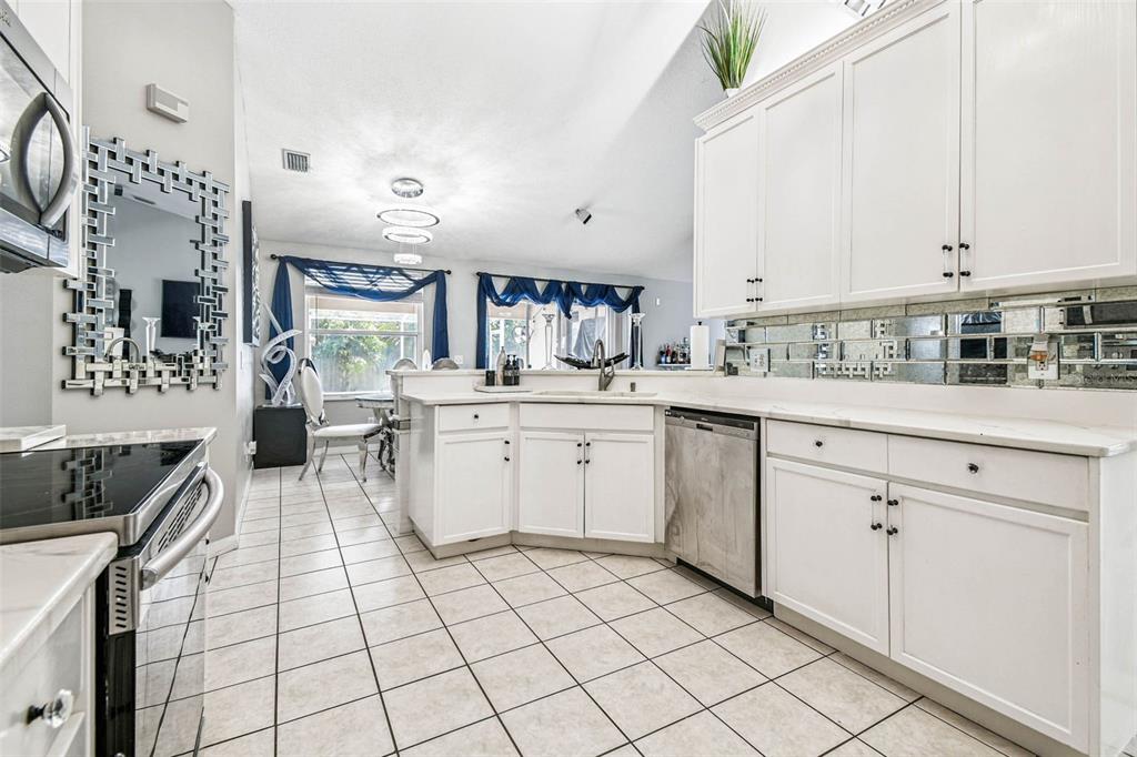 9804 Ocasta Street Riverview, FL 33569 - Photo 5 of 80 a kitchen with a sink cabinets and window