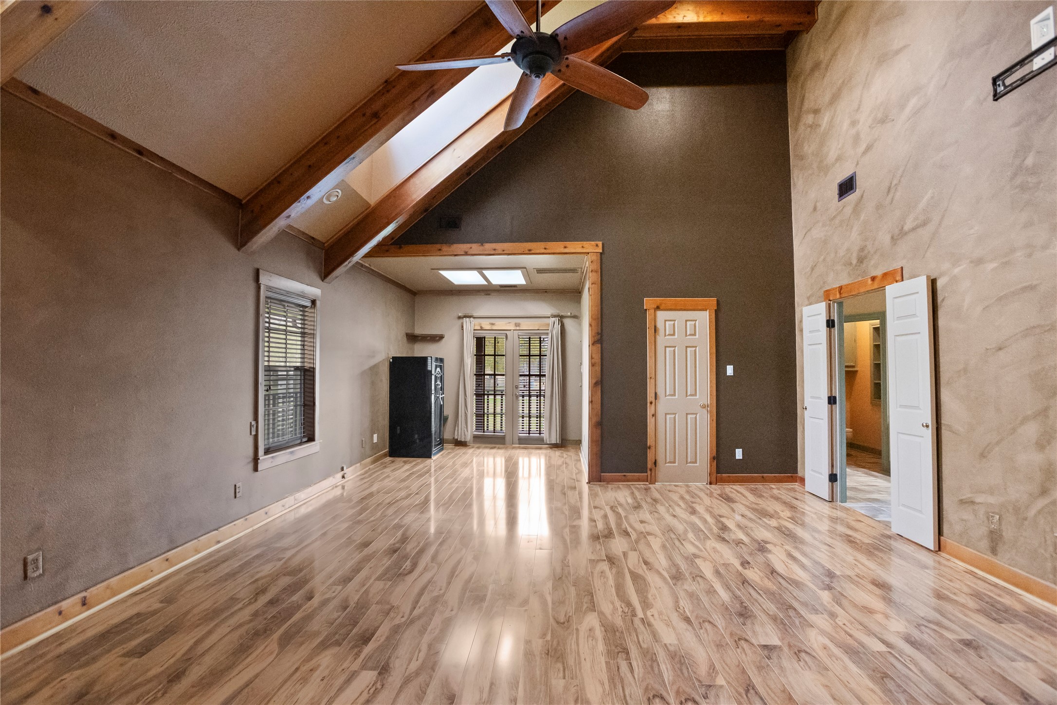22916 East Martin Drive Porter, TX 77365 - Photo 17 of 43 a view of an empty room with wooden floor and a window