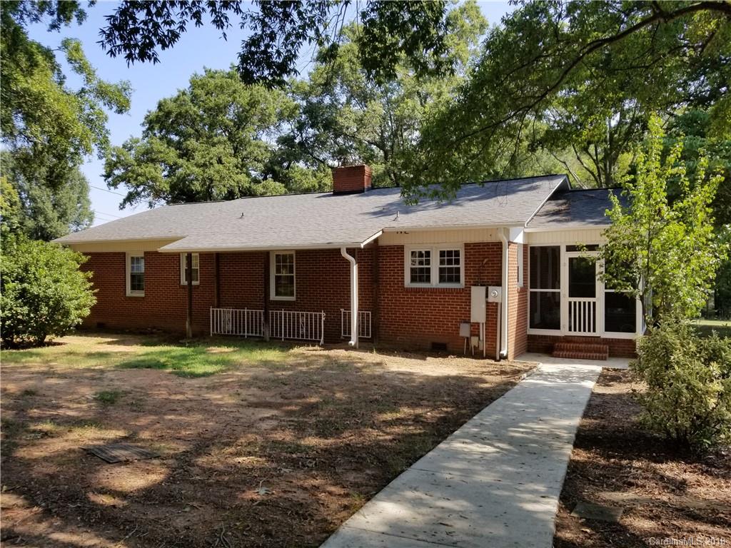 4151 Odell School Road Concord, NC 28027 - Photo 2 of 9 a front view of a house with a garden