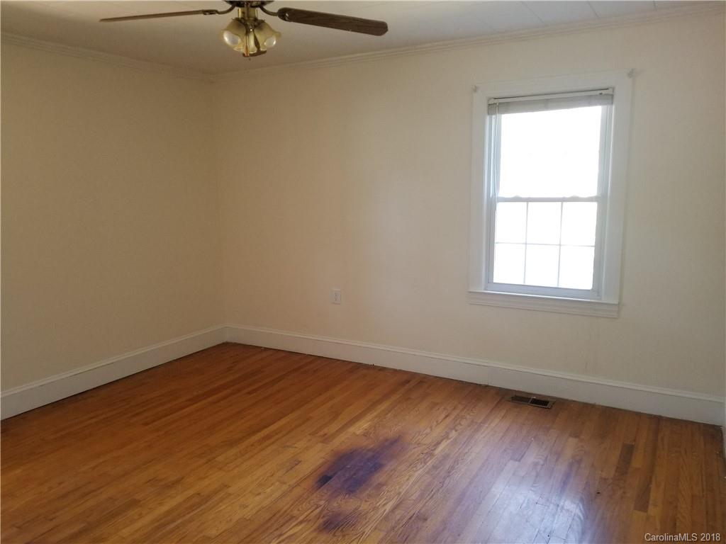 4151 Odell School Road Concord, NC 28027 - Photo 6 of 9 wooden floor in an empty room with a window