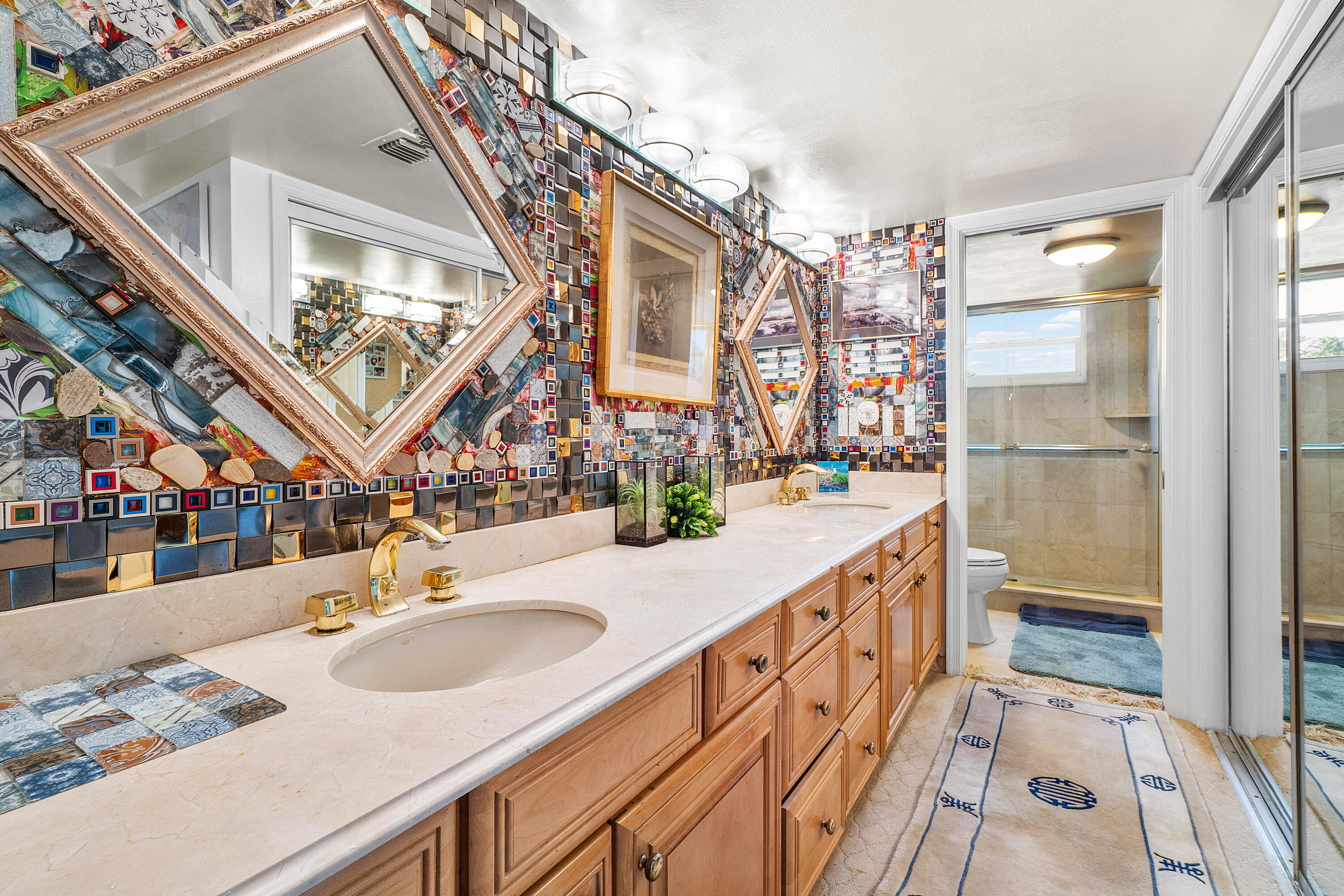 374 Golfview Road, Unit 205 North Palm Beach, FL 33408 - Photo 16 of 35 a bathroom with a sink and a mirror