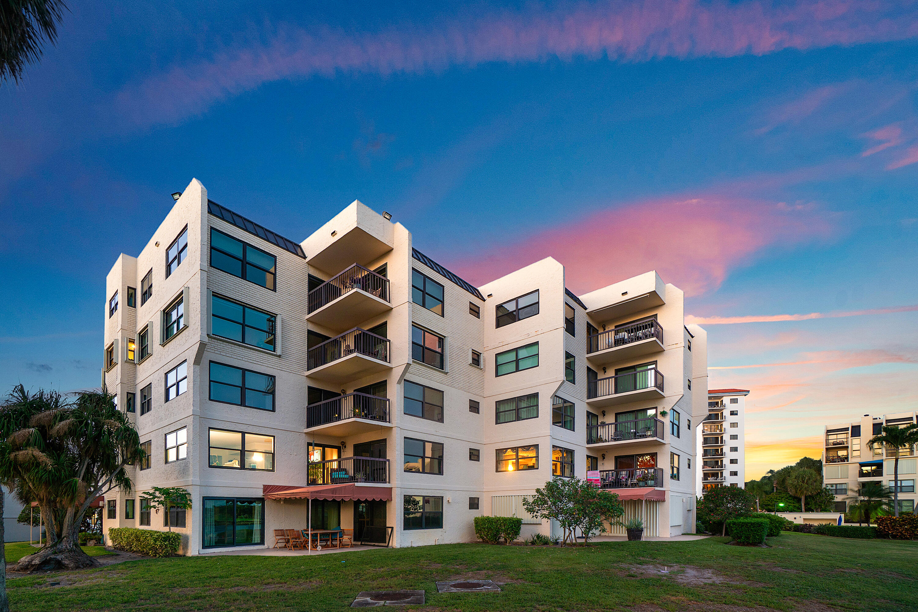 374 Golfview Road, Unit 205 North Palm Beach, FL 33408 - Photo 26 of 35 a front view of building with yard