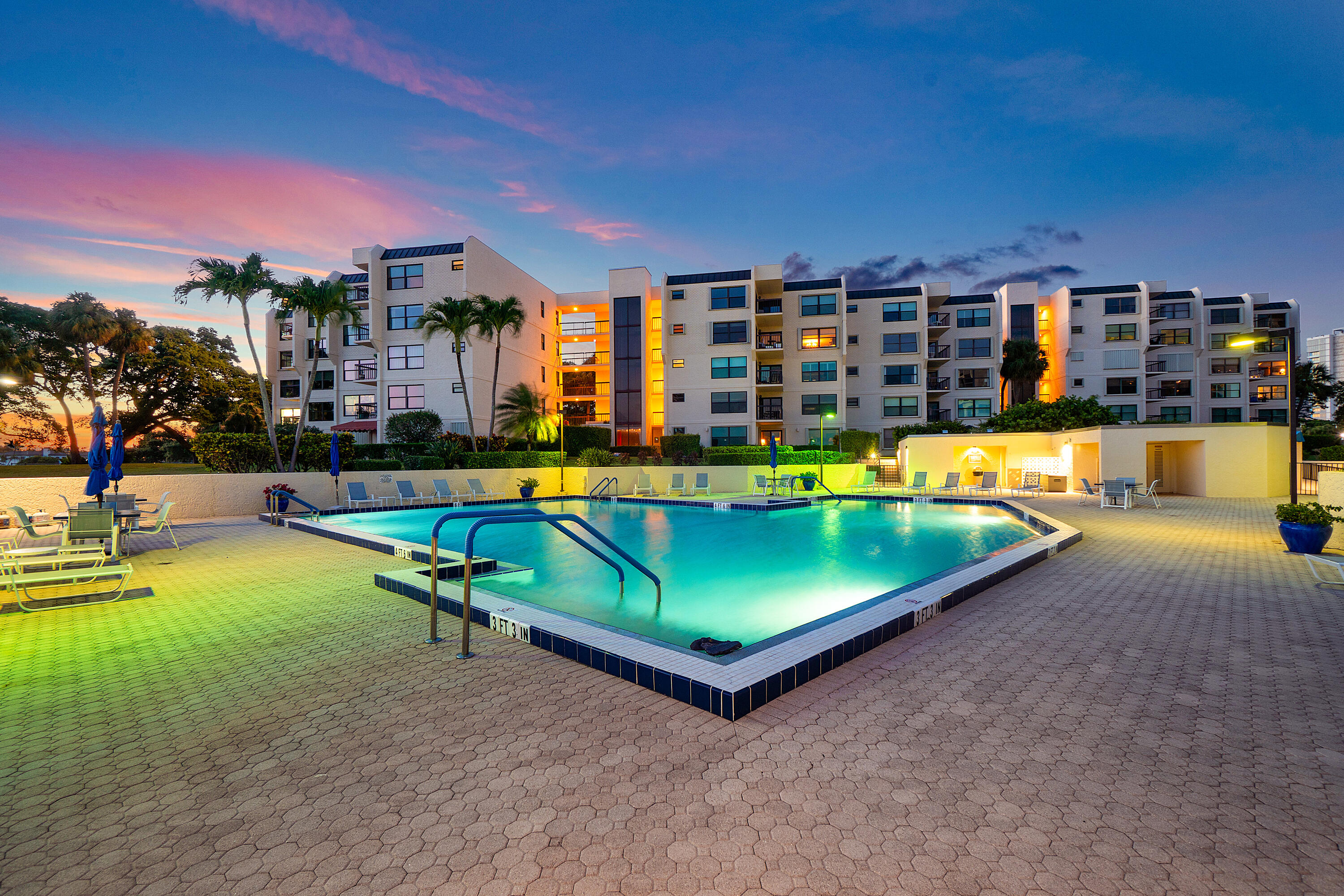 374 Golfview Road, Unit 205 North Palm Beach, FL 33408 - Photo 27 of 35 a swimming pool with outdoor seating and yard