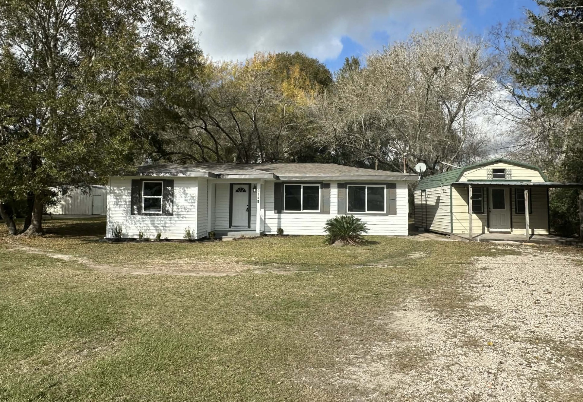 614 Fm 1406 Road Winnie, TX 77665 - Photo 3 of 25 front view of a house with a yard