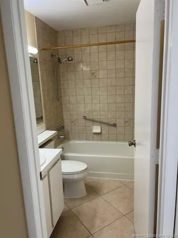 a bathroom with a toilet a sink and bathtub
