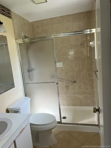 a bathroom with a shower and a toilet