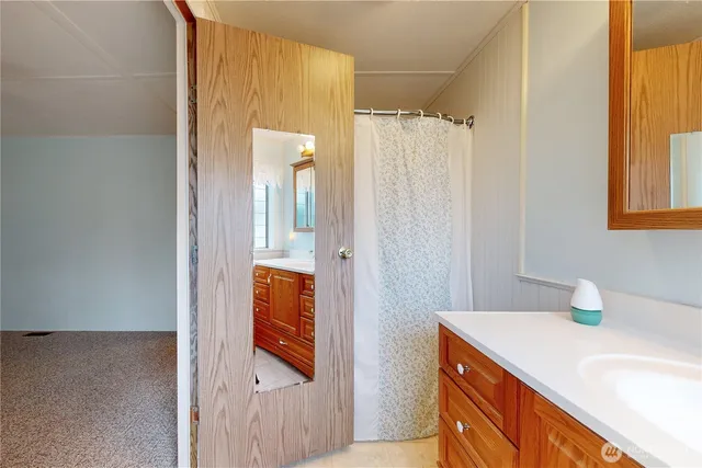 a bathroom with a sink and mirror