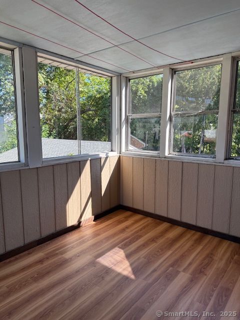 121 Pinehurst Avenue New Britain, CT 06053 - Photo 14 of 14 a view of an empty room with wooden floor and a window