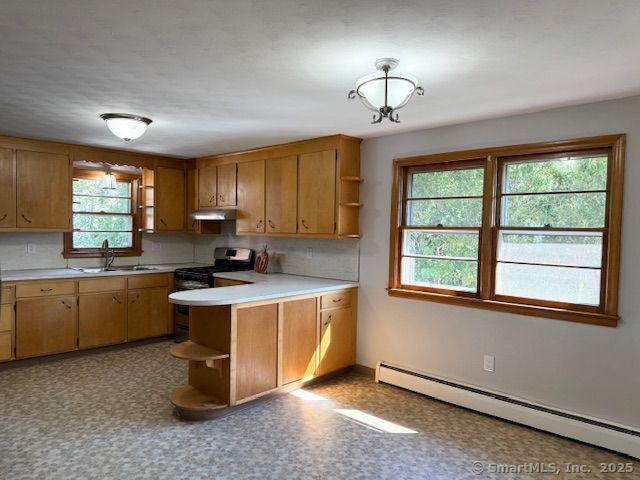 121 Pinehurst Avenue New Britain, CT 06053 - Photo 7 of 14 a kitchen with a stove a sink dishwasher and a refrigerator