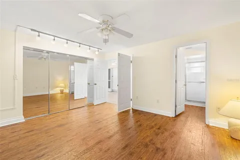a view of an empty room and wooden floor