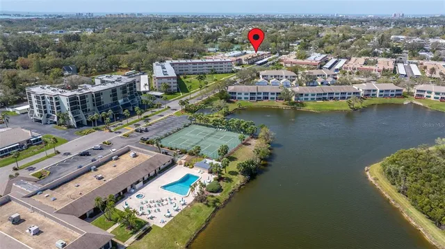 an aerial view of a house with a ocean view