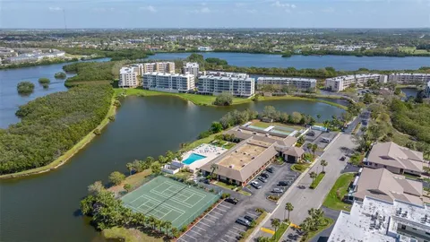 an aerial view of a house with a lake view