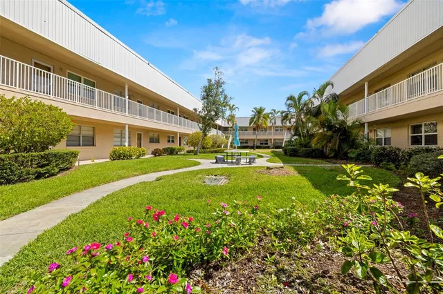 a view of a building with a garden
