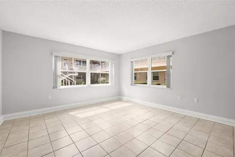 a view of an empty room with windows