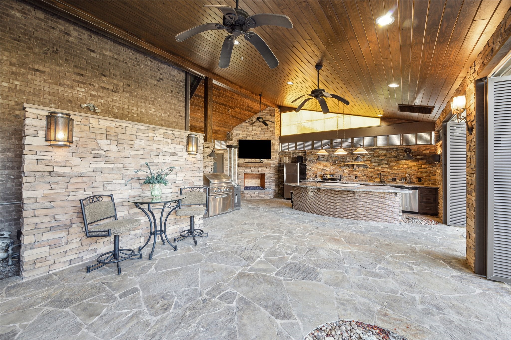 a view of a patio with a table and chairs