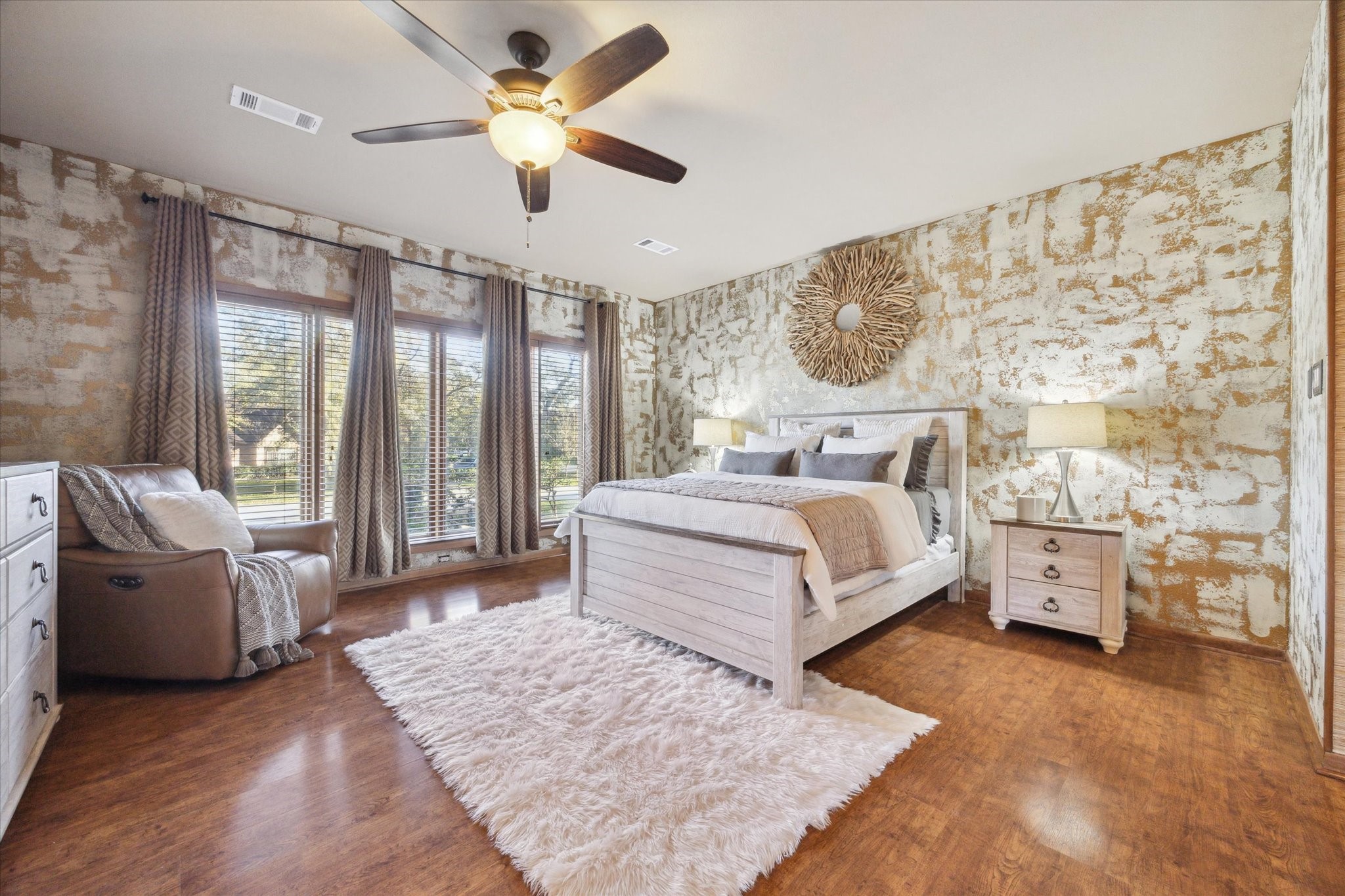 2614 Rip Van Winkle Drive Pearland, TX 77581 - Photo 14 of 31 a bedroom with a large bed and a chandelier fan