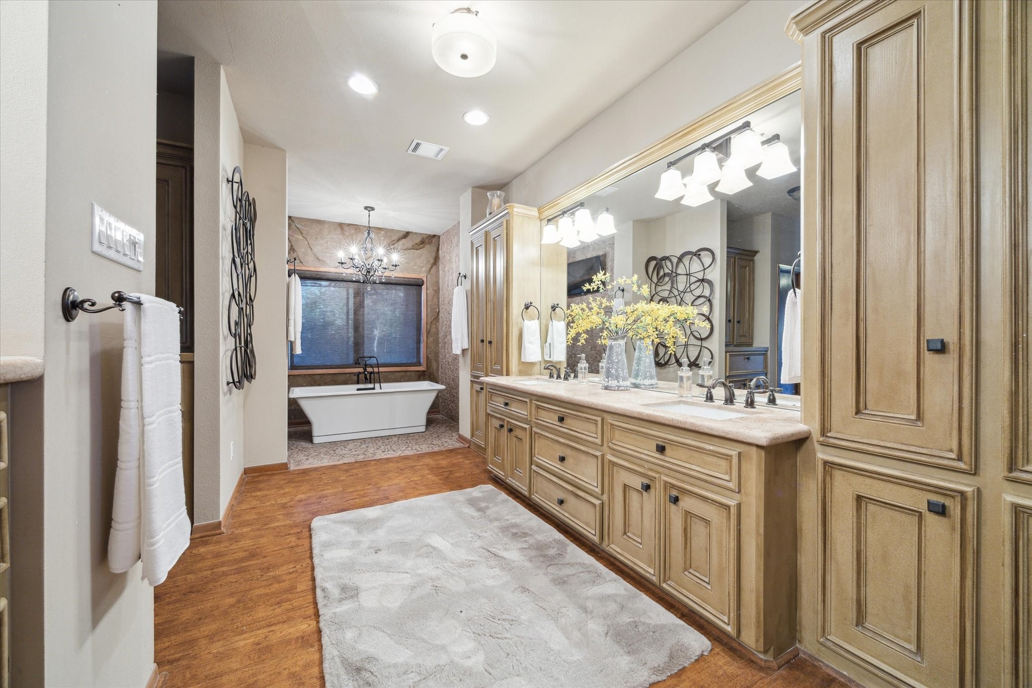 2614 Rip Van Winkle Drive Pearland, TX 77581 - Photo 17 of 31 a large bathroom with a large mirror vanity and shower