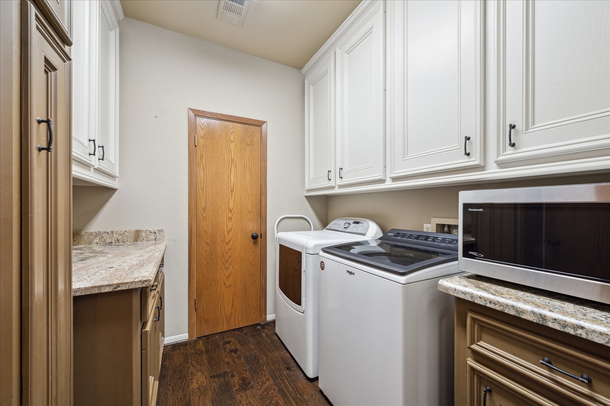 2614 Rip Van Winkle Drive Pearland, TX 77581 - Photo 24 of 31 a kitchen with granite countertop a stove and a white cabinets