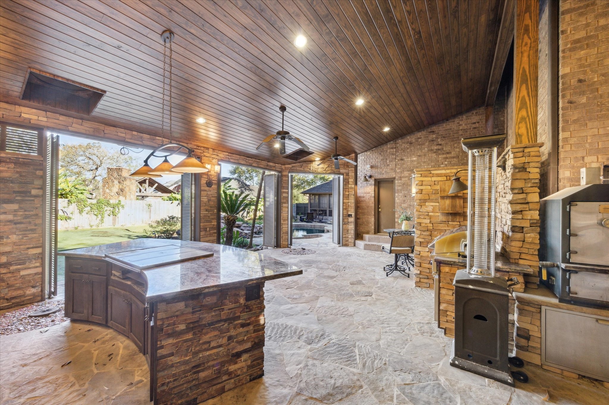 2614 Rip Van Winkle Drive Pearland, TX 77581 - Photo 26 of 31 a view of a patio with table and chairs a barbeque