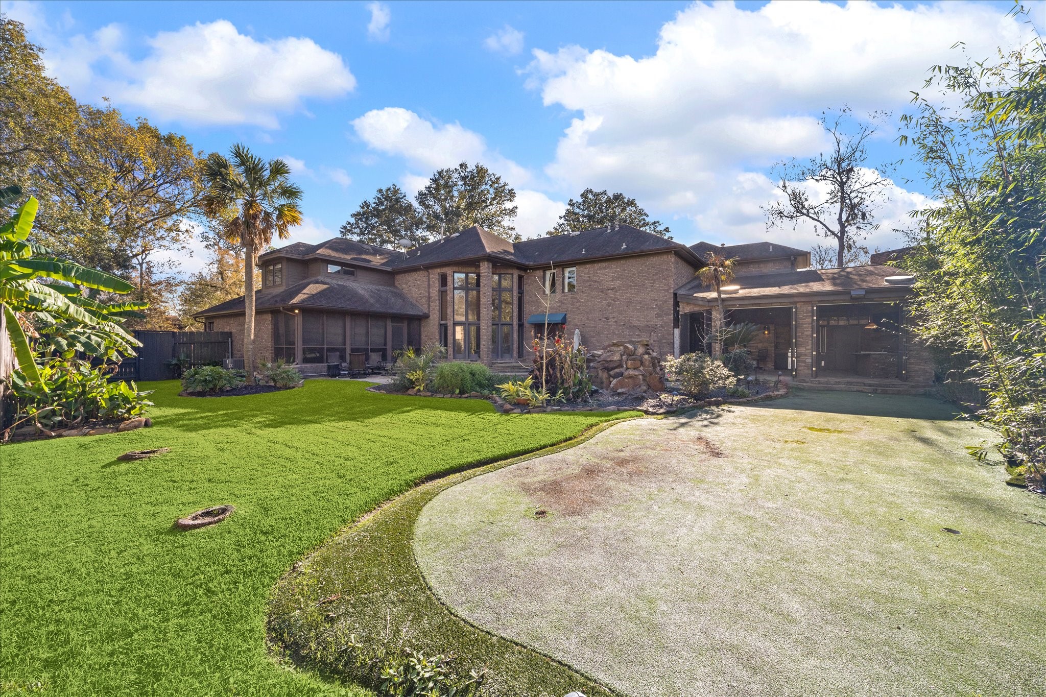 2614 Rip Van Winkle Drive Pearland, TX 77581 - Photo 29 of 31 a view of a house with a yard and fence