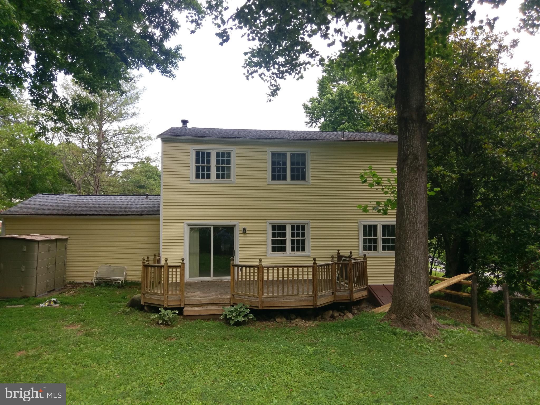 9840 Moyer Road Damascus, MD 20872 - Photo 3 of 20 Back yard with deck, and lots of trees