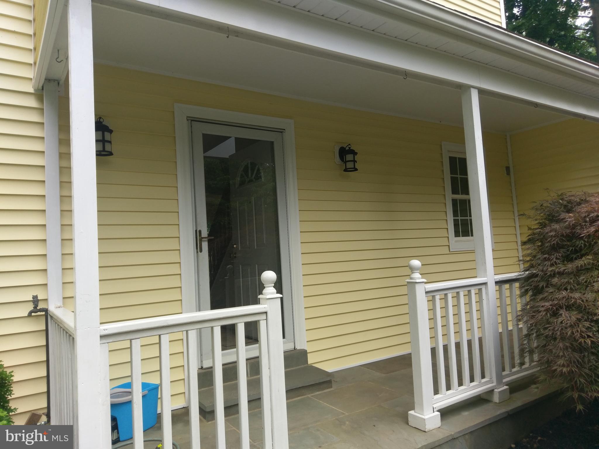 9840 Moyer Road Damascus, MD 20872 - Photo 4 of 20 covered front porch with slate flooring