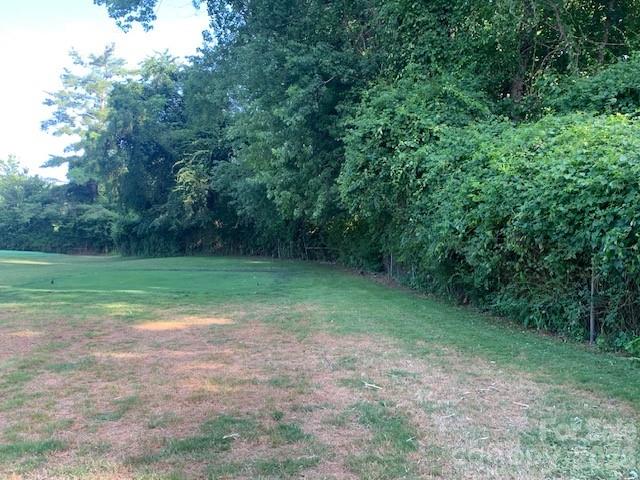 1-2 Country Club Road, Unit 1&2 Hendersonville, NC 28739 - Photo 5 of 10 a view of a field with trees in background