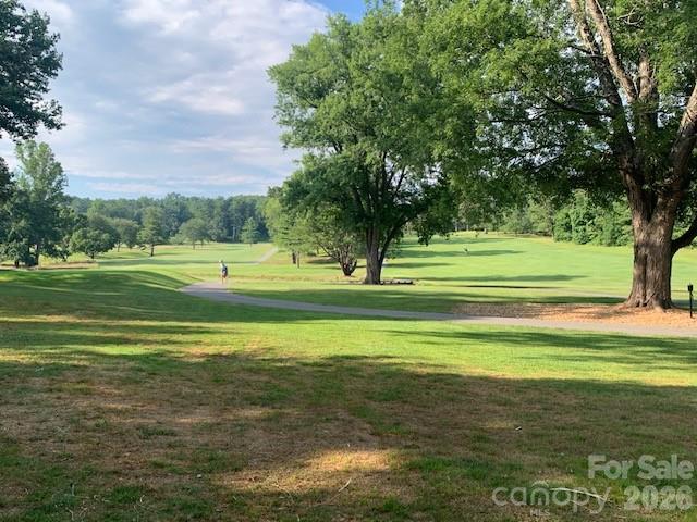 1-2 Country Club Road, Unit 1&2 Hendersonville, NC 28739 - Photo 6 of 10 a view of a golf course with a lake view