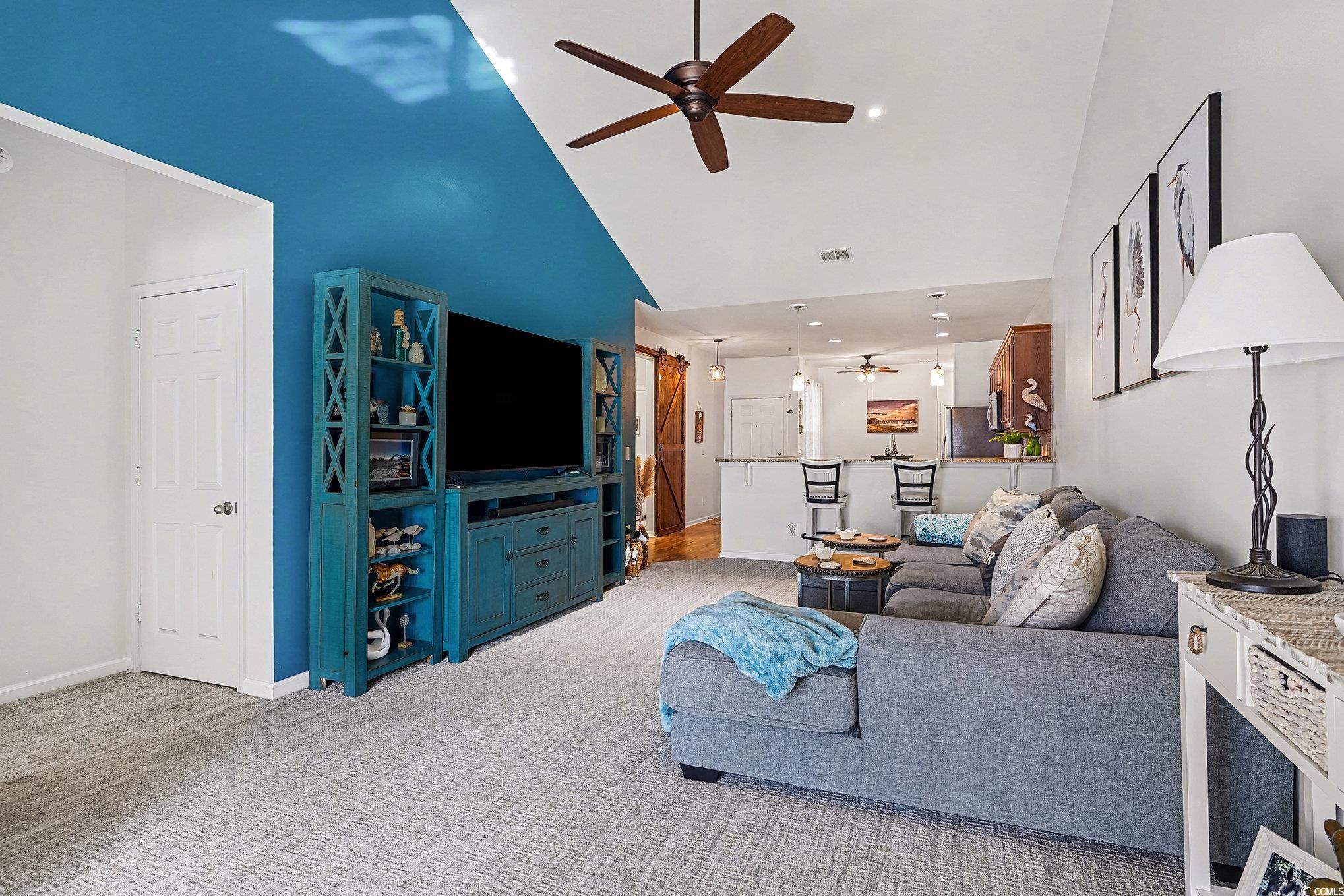 1526 Palmina Loop, Unit C Myrtle Beach, SC 29588 - Photo 11 of 34 Carpeted living room with high vaulted ceiling, a ceiling fan, and recessed lighting