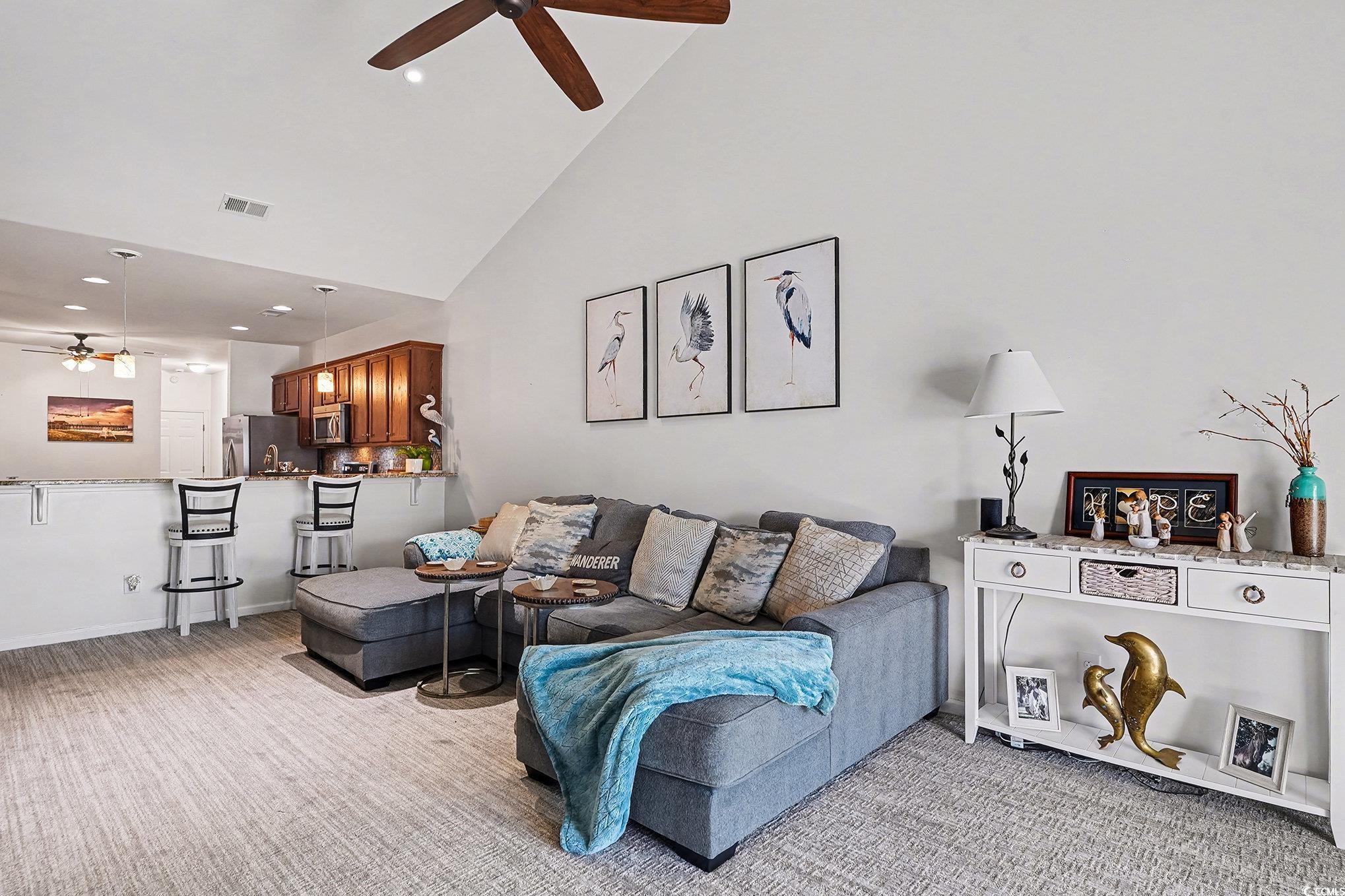 1526 Palmina Loop, Unit C Myrtle Beach, SC 29588 - Photo 13 of 34 Living area with a ceiling fan, recessed lighting, high vaulted ceiling, and light colored carpet
