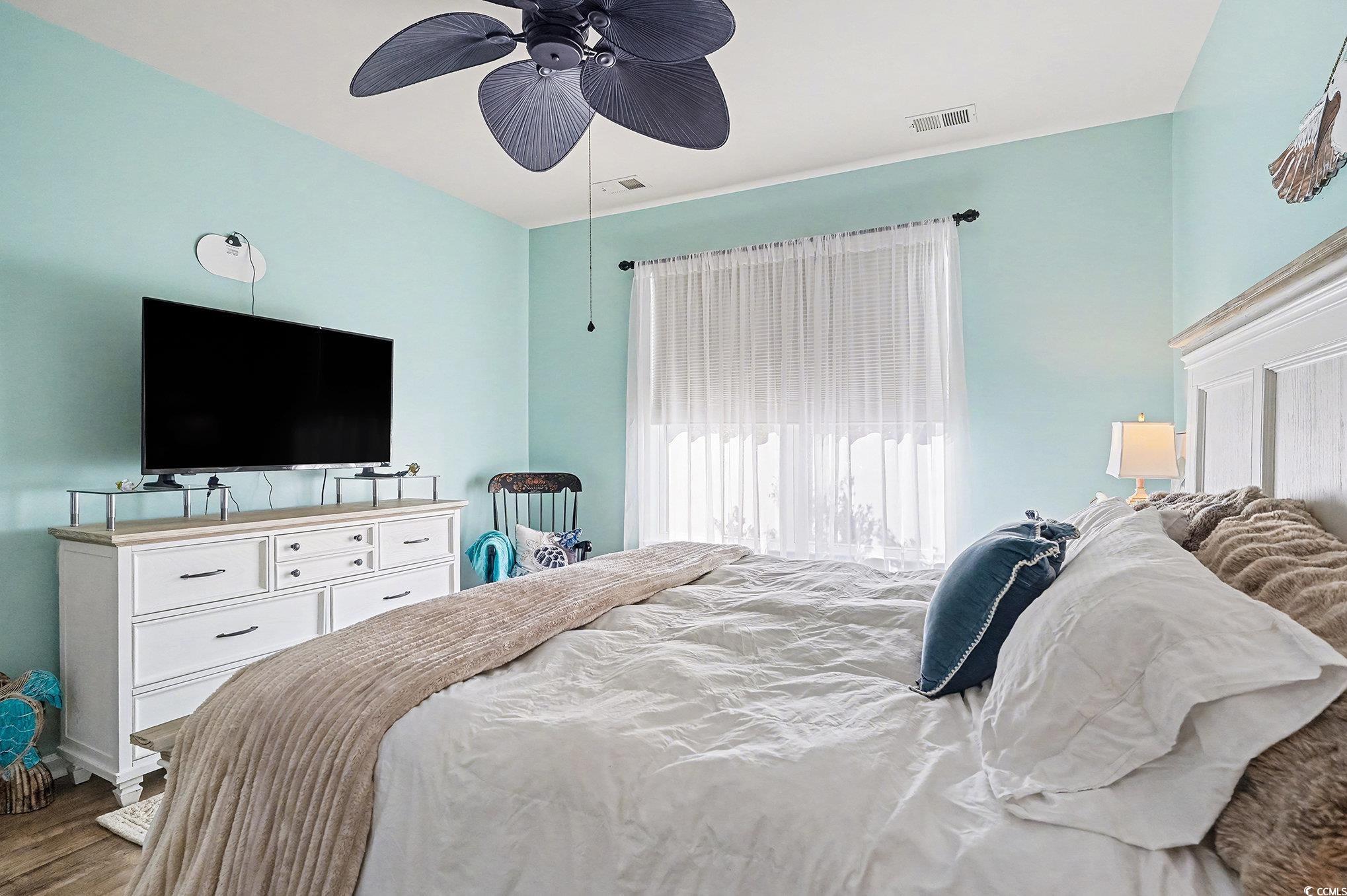 1526 Palmina Loop, Unit C Myrtle Beach, SC 29588 - Photo 16 of 34 Bedroom featuring ceiling fan and wood finished floors