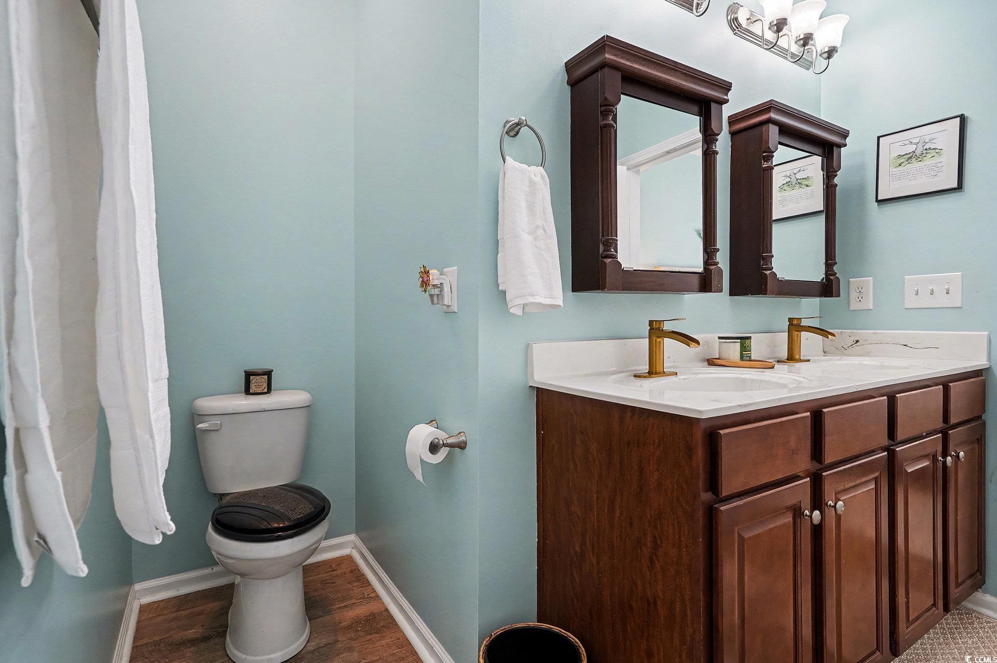 1526 Palmina Loop, Unit C Myrtle Beach, SC 29588 - Photo 18 of 34 Full bath featuring double vanity and wood finished floors