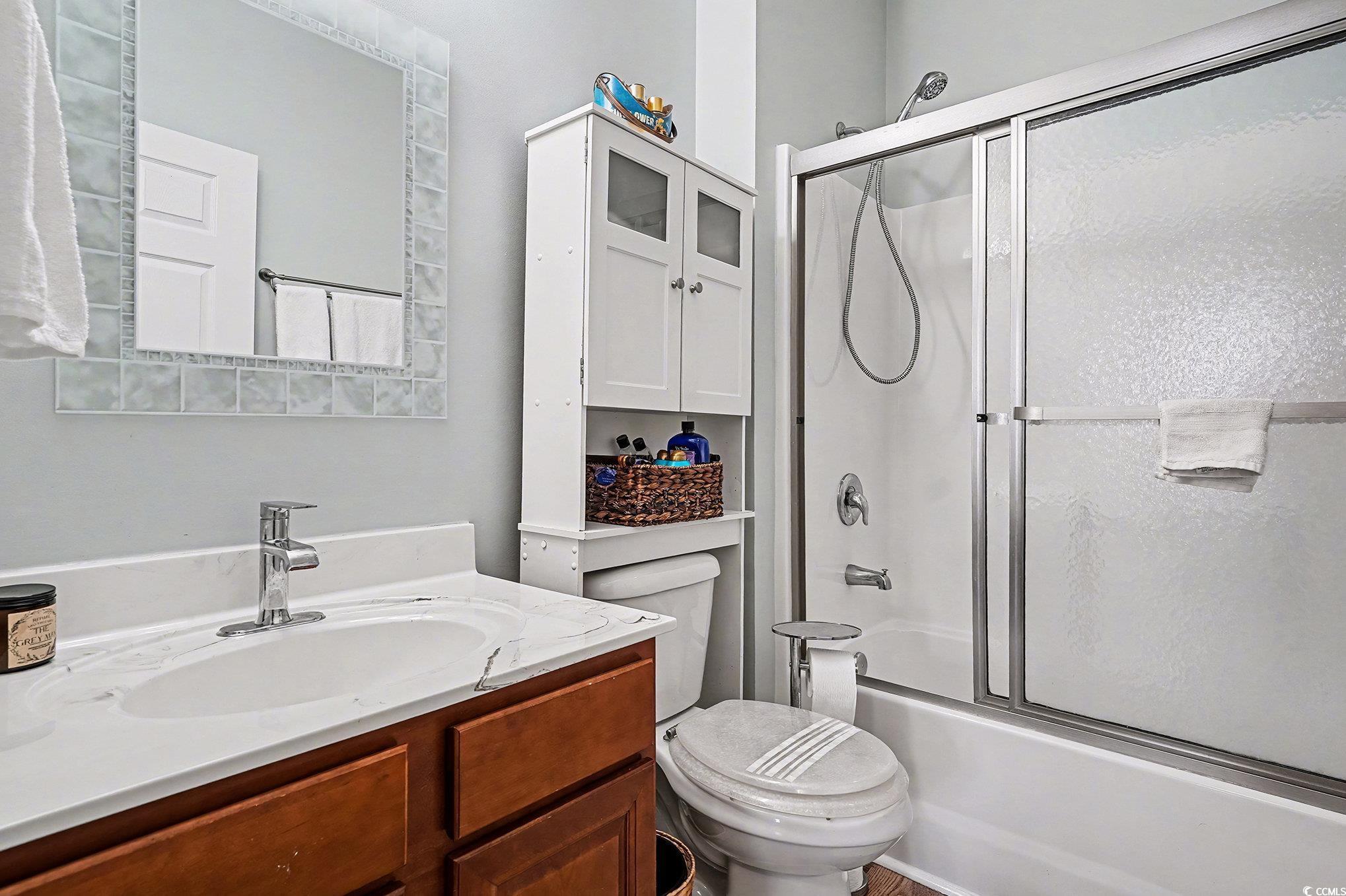 1526 Palmina Loop, Unit C Myrtle Beach, SC 29588 - Photo 23 of 34 Bathroom featuring vanity and combined bath / shower with glass door