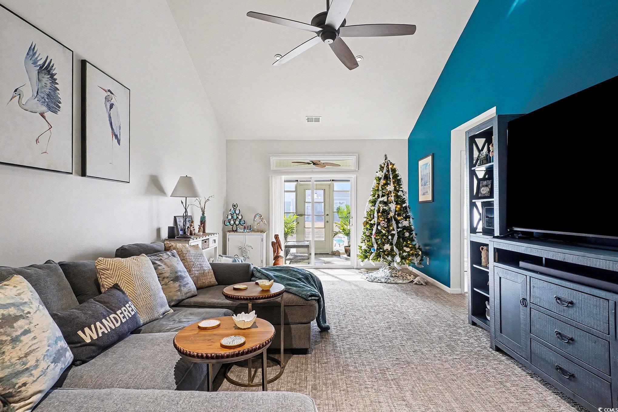 1526 Palmina Loop, Unit C Myrtle Beach, SC 29588 - Photo 9 of 34 Living area with ceiling fan, light carpet, french doors, and high vaulted ceiling